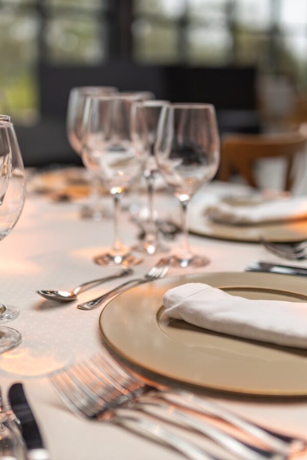 Sophisticated table setup with glassware and napkins for fine dining experience.